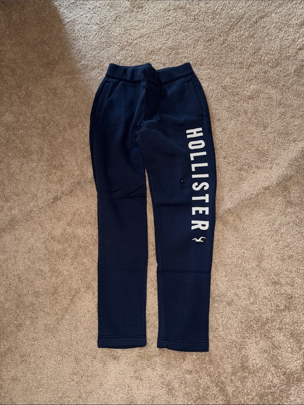 Hollister Navy Sweatpants with White Logo Down Leg